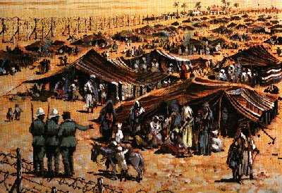 A painting of a sprawling desert concentration camp, full of tents and people.  Three Italian soldiers in green uniforms are standing together in the foreground talking.